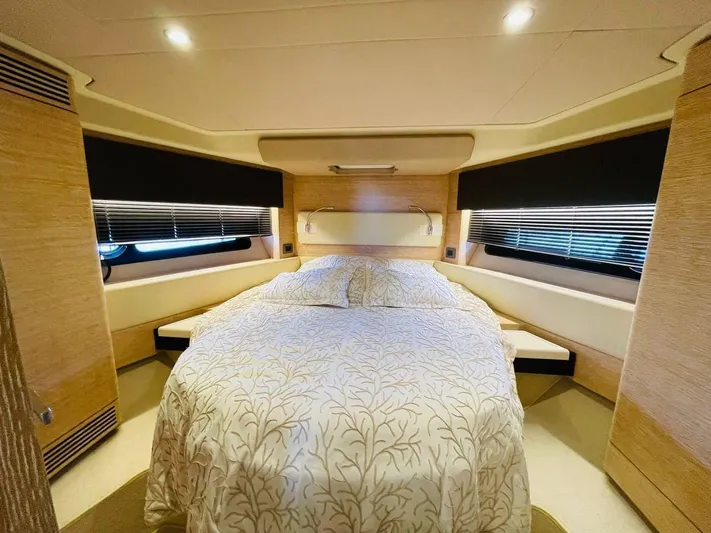 Vika Yacht Photos Pics Luxurious bedroom interior of 2016 Azimut Fly 50 yacht with elegant bedding and ambient lighting.