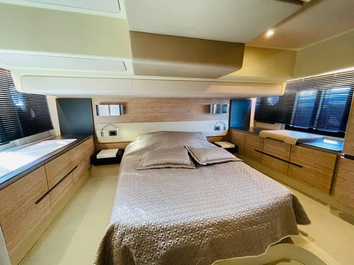 Vika Yacht Photos Pics Luxurious bedroom interior of 2016 Azimut Fly 50 yacht with modern design and elegant furnishings.
