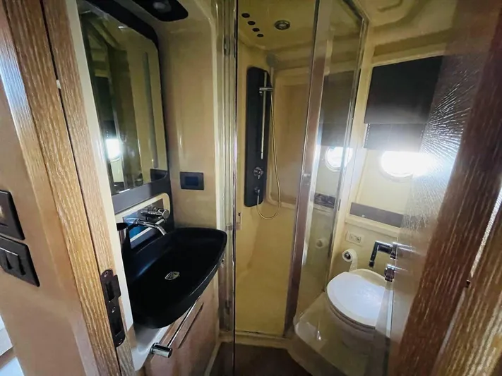 Vika Yacht Photos Pics Luxurious bathroom in 2016 Azimut Fly 50 yacht with modern fixtures and shower.