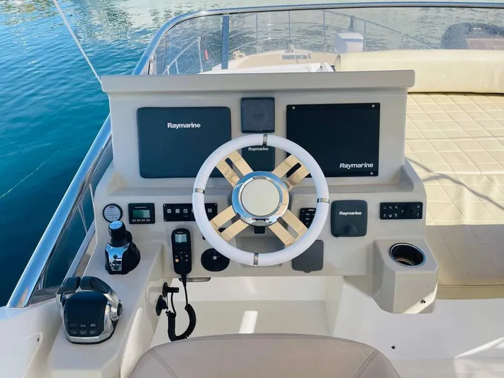 Vika Yacht Photos Pics Cockpit of 2016 Azimut Fly 50 yacht with Raymarine navigation system.