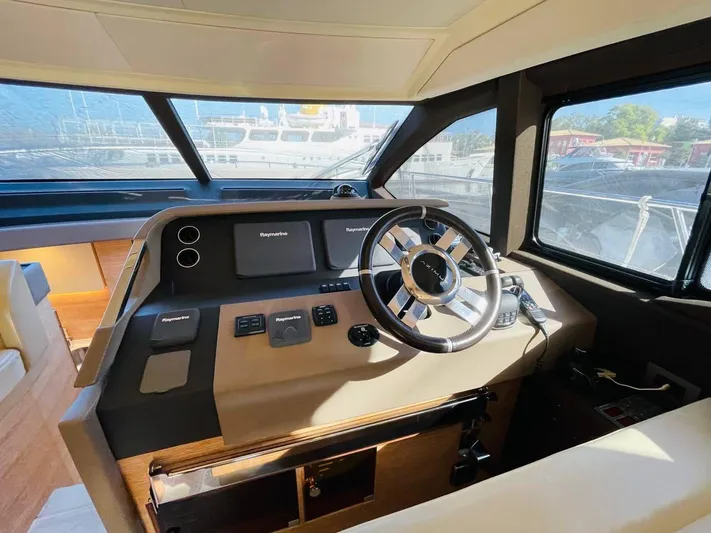 Vika Yacht Photos Pics Helm of 2016 Azimut Fly 50 yacht with modern controls and steering wheel.