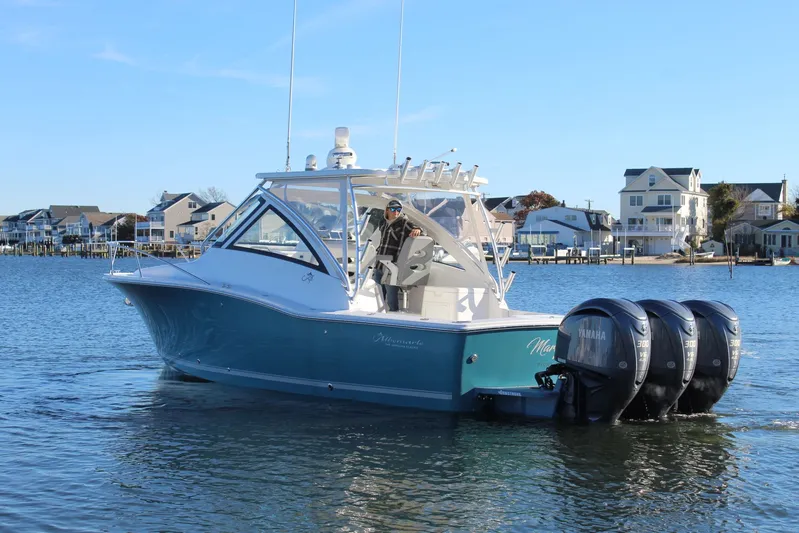 Mary Michele Yacht Photos Pics 2022 Albemarle 30 Express boat with triple Yamaha engines on a calm waterway.