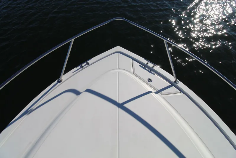 Mary Michele Yacht Photos Pics Bow of 2022 Albemarle 30 Express boat on water with sunlight reflections.