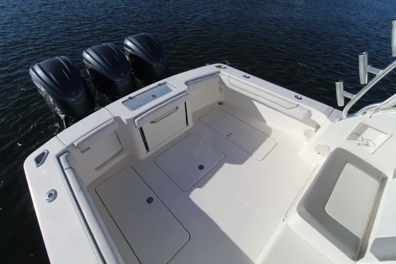 Mary Michele Yacht Photos Pics 2022 Albemarle 30 Express boat deck with triple outboard motors on water.