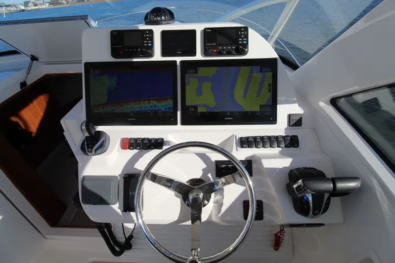 Mary Michele Yacht Photos Pics 2022 Albemarle 30 Express helm with dual Garmin displays and modern controls.