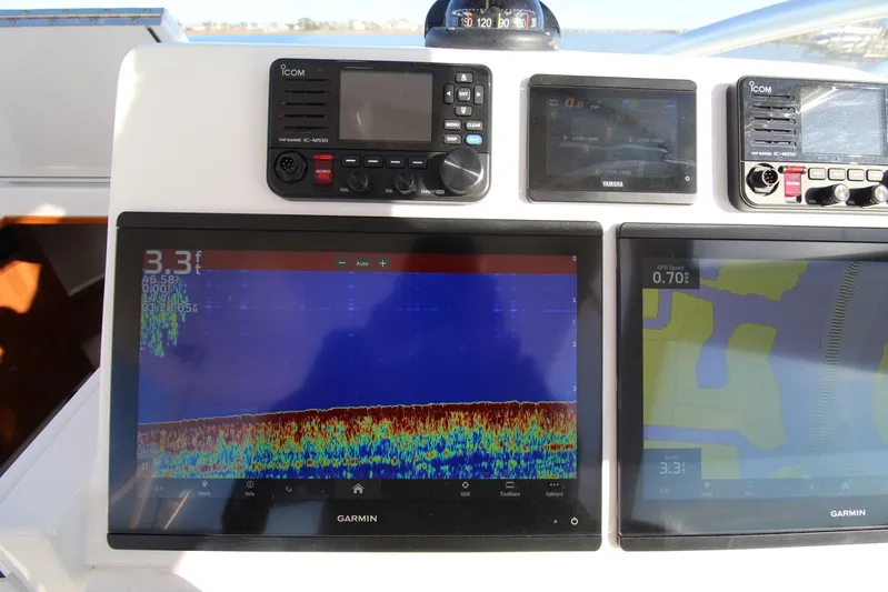 Mary Michele Yacht Photos Pics Dashboard of a 2022 Albemarle 30 Express with Garmin navigation displays.