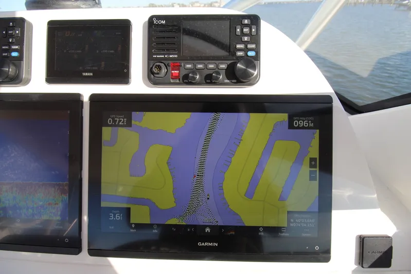Mary Michele Yacht Photos Pics Navigation system on 2022 Albemarle 30 Express boat, featuring Garmin and Icom displays.