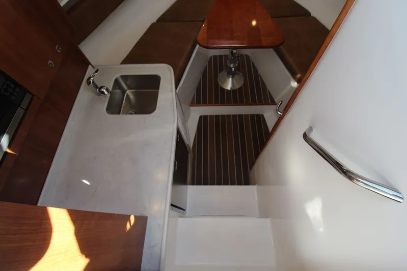 Mary Michele Yacht Photos Pics 2022 Albemarle 30 Express interior with sink, countertop, and seating area.