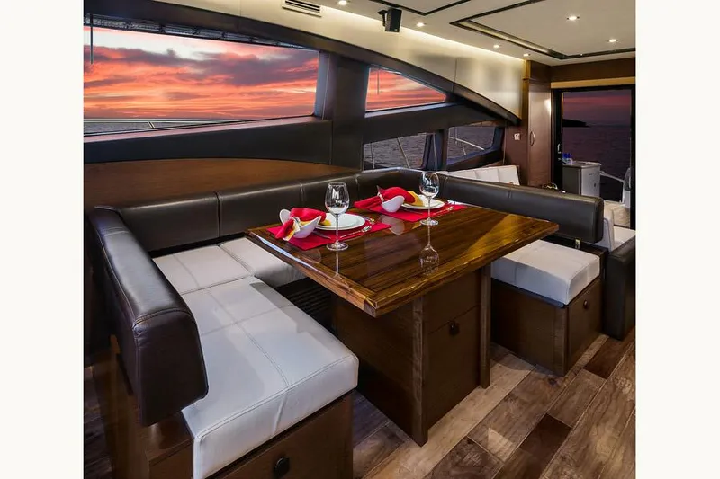 Special K Yacht Photos Pics Manufacturer Provided Image: Luxurious dining area on 2016 Sea Ray L650 yacht with sunset view.