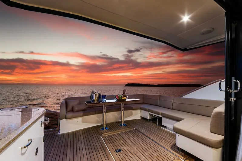 Special K Yacht Photos Pics Manufacturer Provided Image: Luxurious 2016 Sea Ray L650 yacht deck at sunset with ocean view.