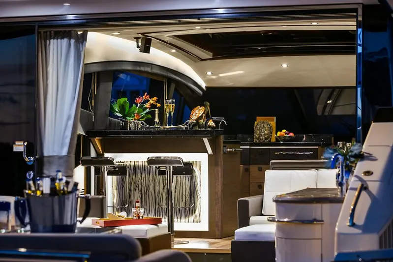 Special K Yacht Photos Pics Manufacturer Provided Image: Luxurious interior of 2016 Sea Ray L650 yacht with modern bar and seating area.