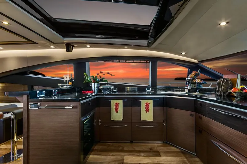Special K Yacht Photos Pics Manufacturer Provided Image: Luxurious kitchen interior of 2016 Sea Ray L650 yacht with sunset view.