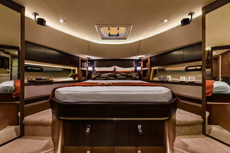 Special K Yacht Photos Pics Manufacturer Provided Image: Luxurious master bedroom in 2016 Sea Ray L650 yacht with modern decor and ambient lighting.