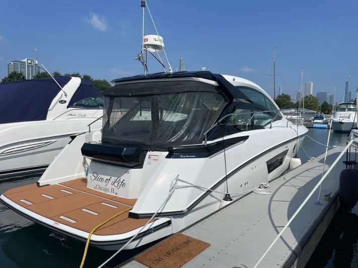 Yacht Photos Pics 2018 Beneteau Gran Turismo 40 yacht docked at marina under clear blue sky.
