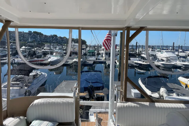  Yacht Photos Pics View from 1999 Mainship 430 Trawler overlooking marina with numerous docked boats.