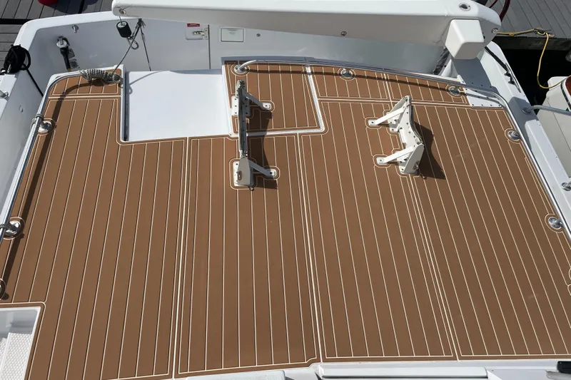  Yacht Photos Pics 1999 Mainship 430 Trawler deck with brown and white striped flooring.