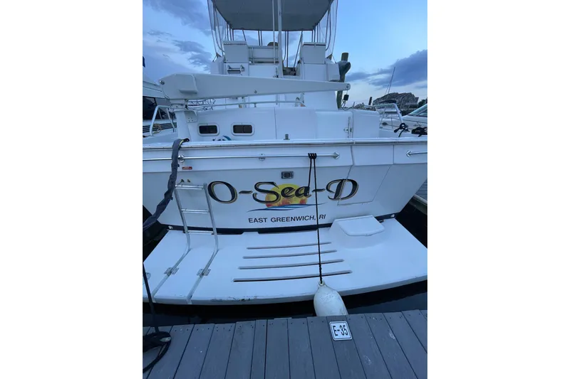  Yacht Photos Pics 1999 Mainship 430 Trawler docked, rear view with "O-Sea-D" name, East Greenwich, RI.