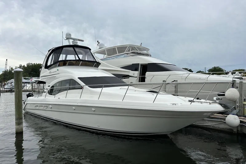 Our Alibi Yacht Photos Pics 2004 Sea Ray 420 Sedan Bridge yacht docked at marina.