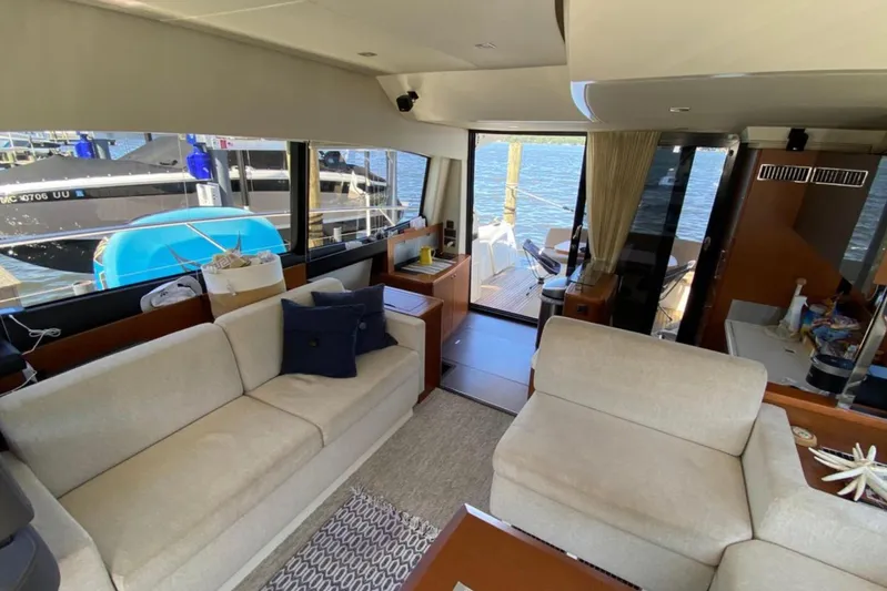  Yacht Photos Pics Luxurious interior of a 2012 Prestige 500 yacht with comfortable seating and waterfront view.