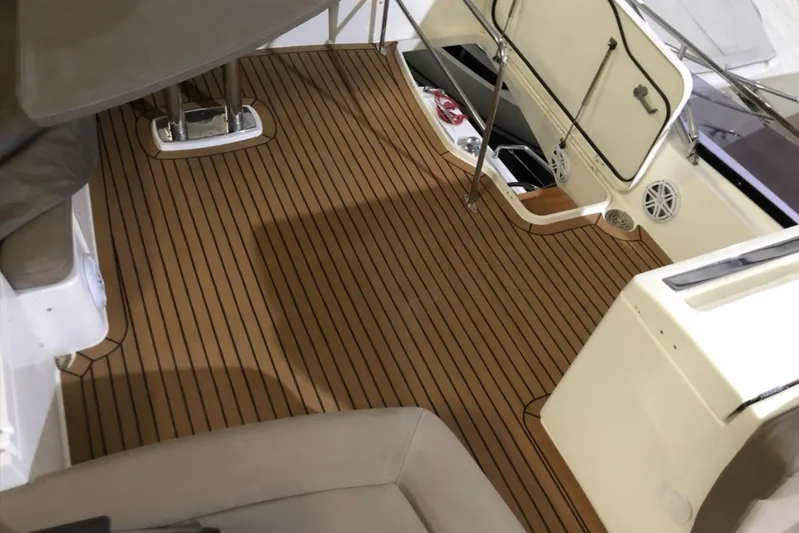  Yacht Photos Pics Luxurious 2012 Prestige 500 yacht interior with elegant wooden flooring and seating area.