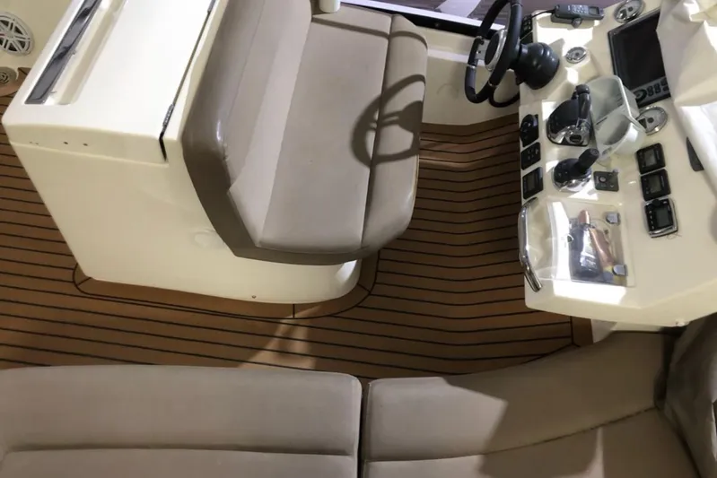  Yacht Photos Pics Prestige 500 yacht helm, 2012 model, featuring beige seating and wooden flooring.