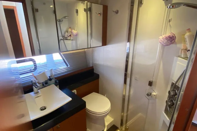  Yacht Photos Pics Luxurious bathroom in 2012 Prestige 500 yacht with modern fixtures and glass shower.