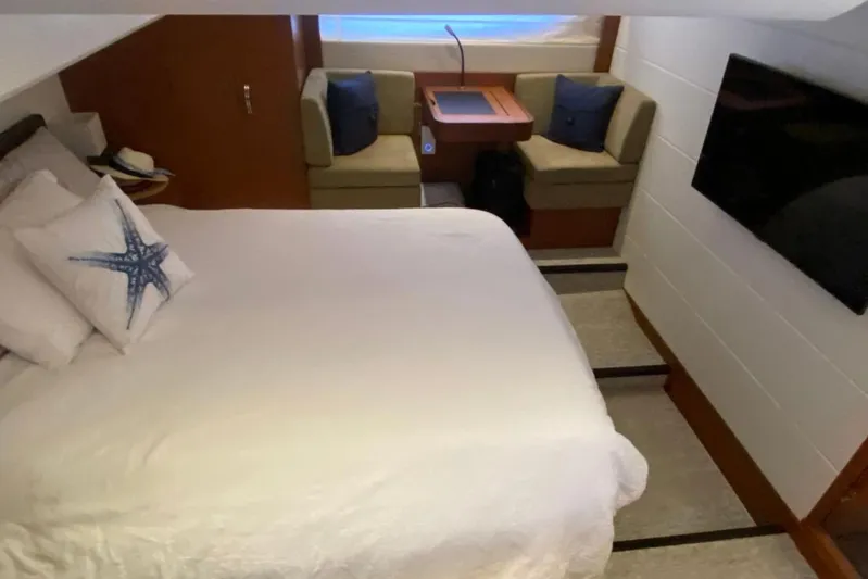  Yacht Photos Pics Luxurious cabin interior of a 2012 Prestige 500 yacht with bed, seating, and TV.