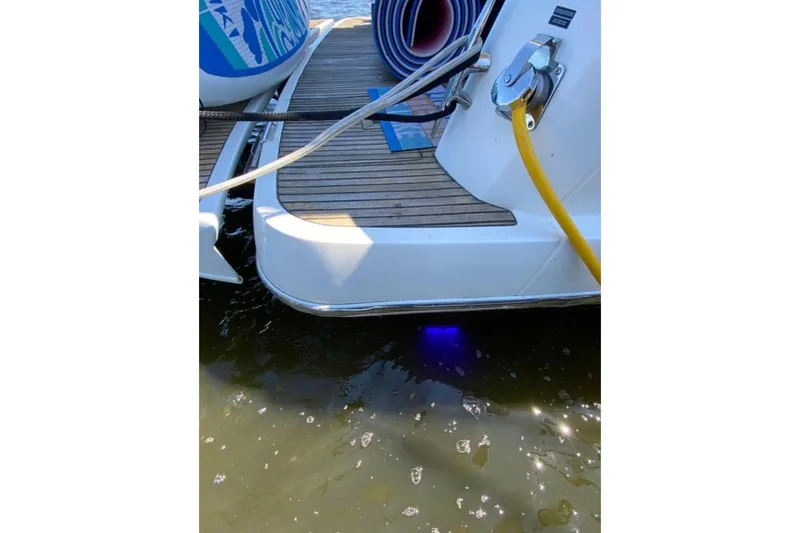  Yacht Photos Pics 2012 Prestige 500 yacht stern with deck, yellow cable, and water reflection.