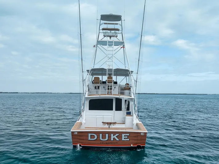  Yacht Photos Pics 2001 Viking 65 yacht named "DUKE" on calm ocean waters.