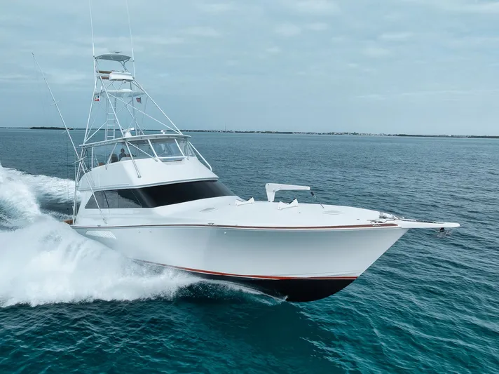  Yacht Photos Pics 2001 Viking 65 yacht cruising on open water, showcasing sleek design and powerful performance.