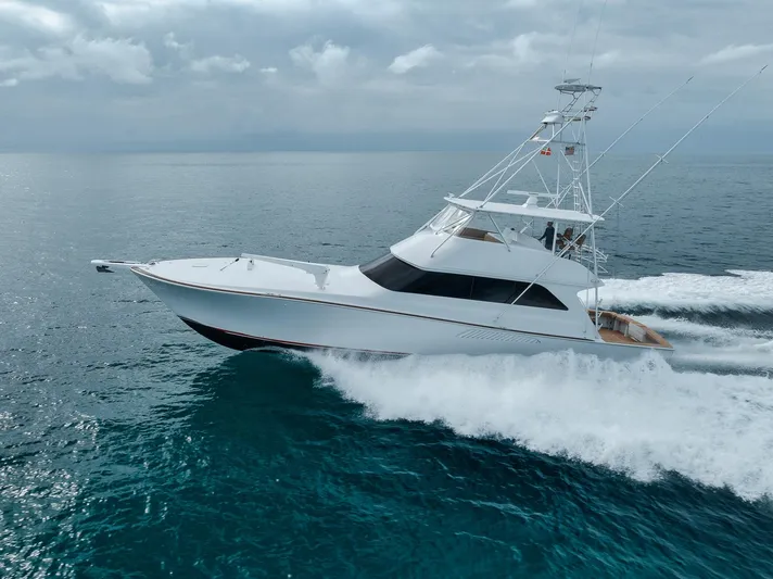  Yacht Photos Pics 2001 Viking 65 yacht cruising on open sea with white waves.