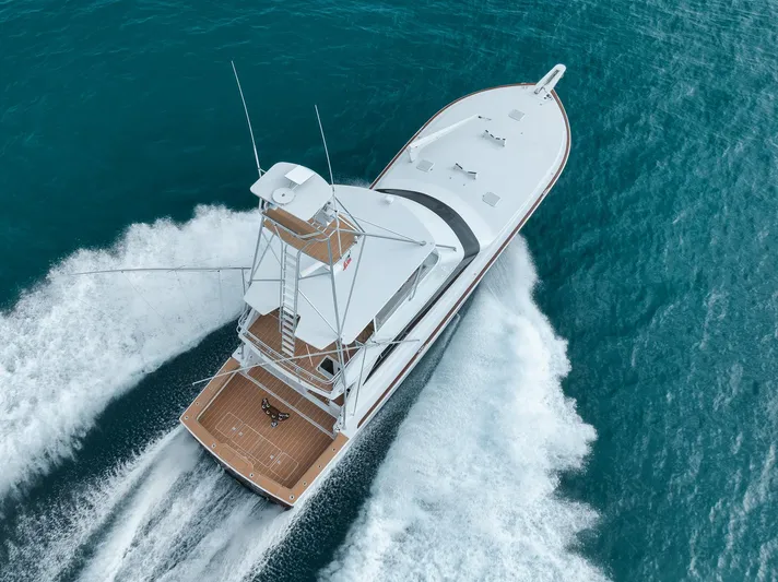  Yacht Photos Pics Aerial view of 2001 Viking 65 yacht cruising on blue ocean waters.