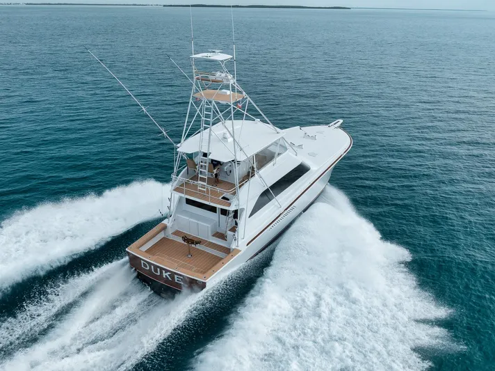  Yacht Photos Pics Viking 65 yacht cruising on open water, 2001 model, aerial view.