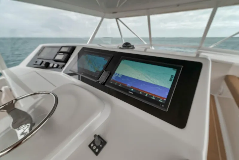  Yacht Photos Pics Control panel of a 2001 Viking 65 yacht with navigation screens.