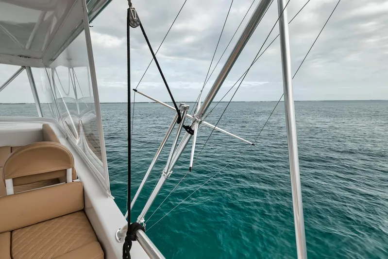  Yacht Photos Pics 2001 Viking 65 yacht with fishing outriggers on open sea.