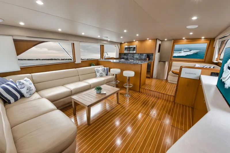 Yacht Photos Pics Luxurious interior of a 2001 Viking 65 yacht with elegant seating and modern amenities.