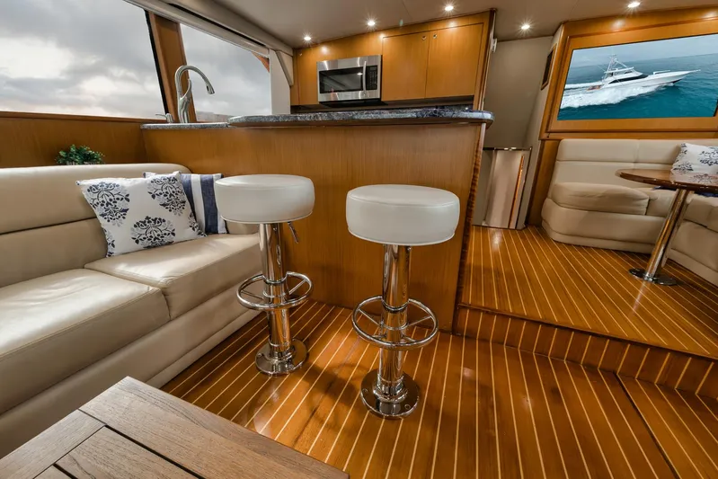  Yacht Photos Pics Luxurious interior of 2001 Viking 65 yacht with modern kitchen and seating area.