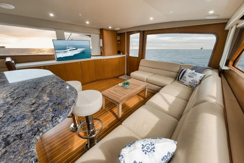  Yacht Photos Pics Luxurious interior of a 2001 Viking 65 yacht with ocean view and modern furnishings.