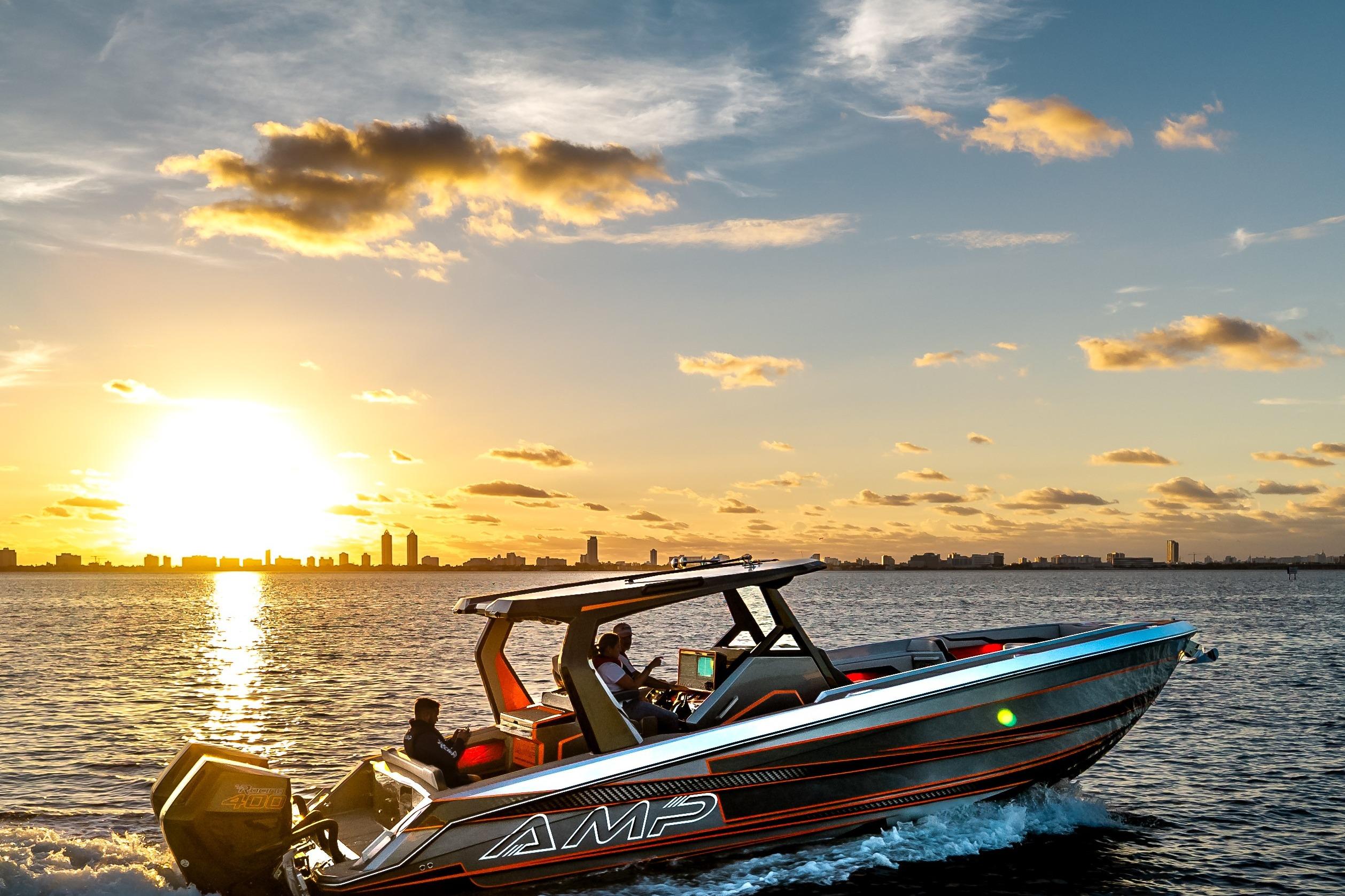 A sleek AMP 333 boat cruising at sunset, 2026 model, on a serene waterway.