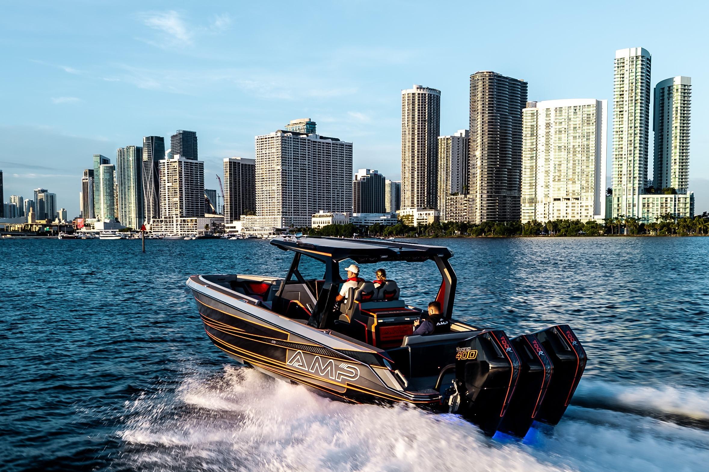 High-speed AMP 333 boat cruising near city skyline, 2026 model.