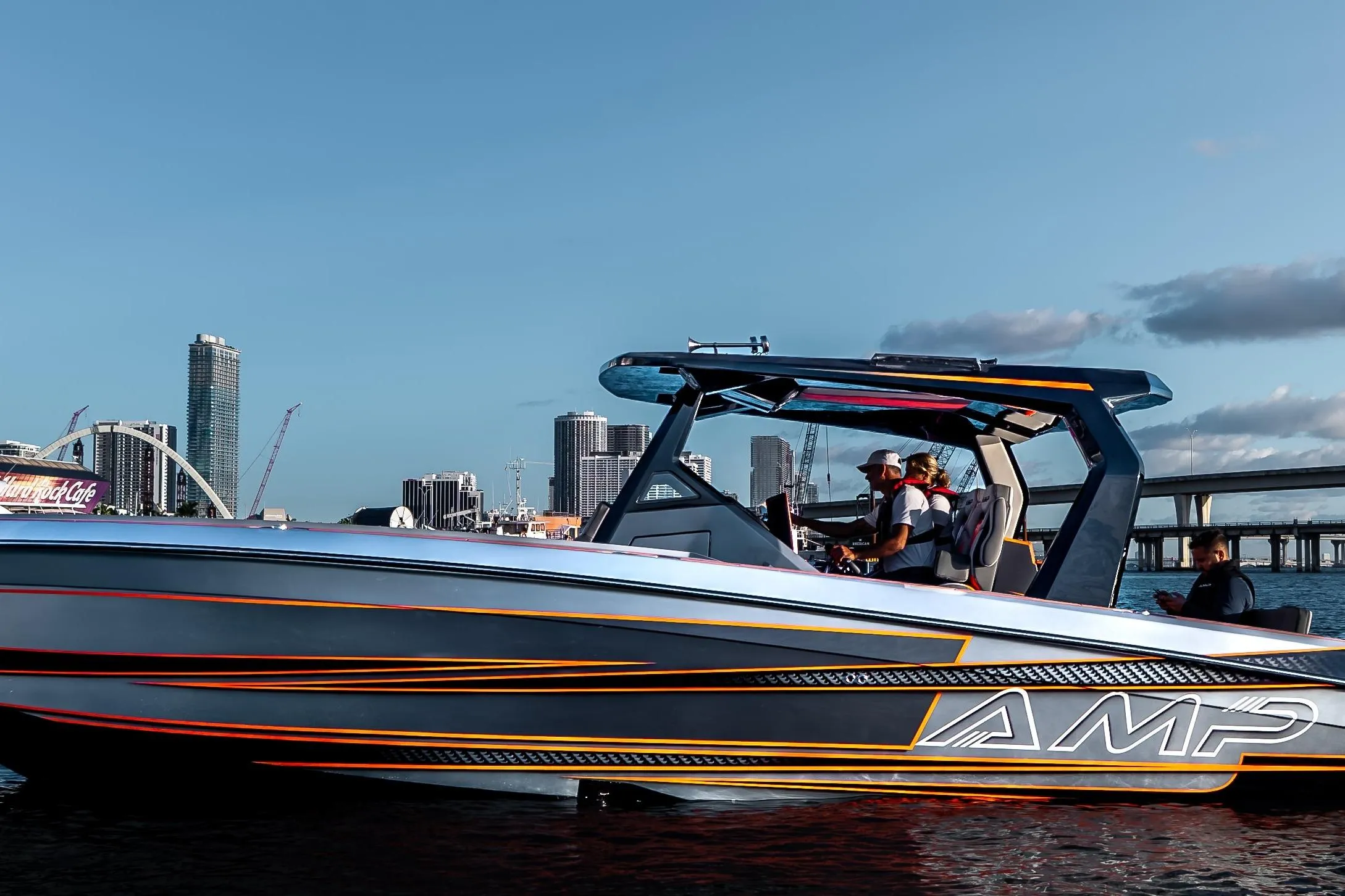 Futuristic AMP 333 speedboat cruising near city skyline, 2026 model.