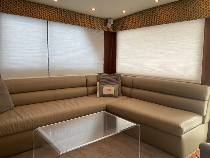  Yacht Photos Pics Luxurious interior of 1984 Hatteras 52 Convertible yacht with leather seating and modern decor.