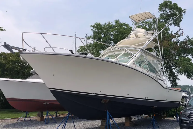 Reel Freedom II Yacht Photos Pics 2007 Carolina Classic 35 Express boat on stands, side view, outdoors.