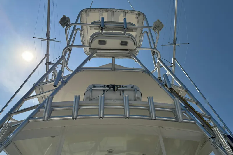Reel Freedom II Yacht Photos Pics 2007 Carolina Classic 35 Express boat tower under clear blue sky.