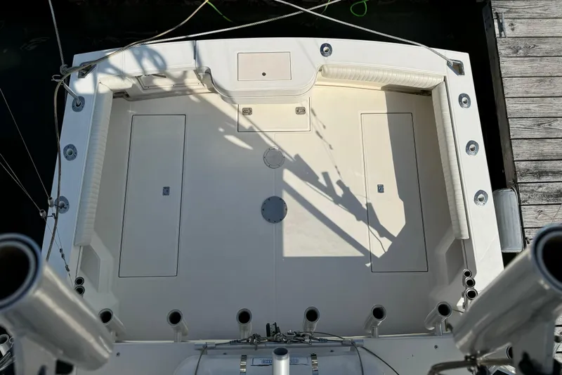 Reel Freedom II Yacht Photos Pics 2007 Carolina Classic 35 Express boat deck with rod holders and storage compartments.