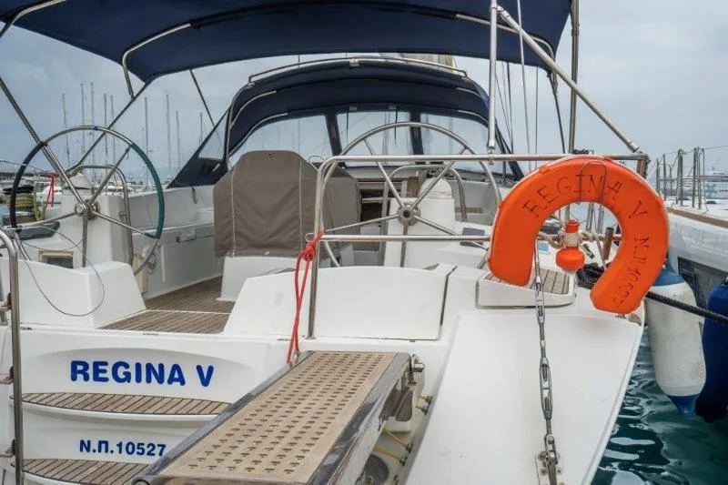  Yacht Photos Pics Jeanneau 53 sailboat, 2010 model, named Regina V, docked with visible steering wheels.