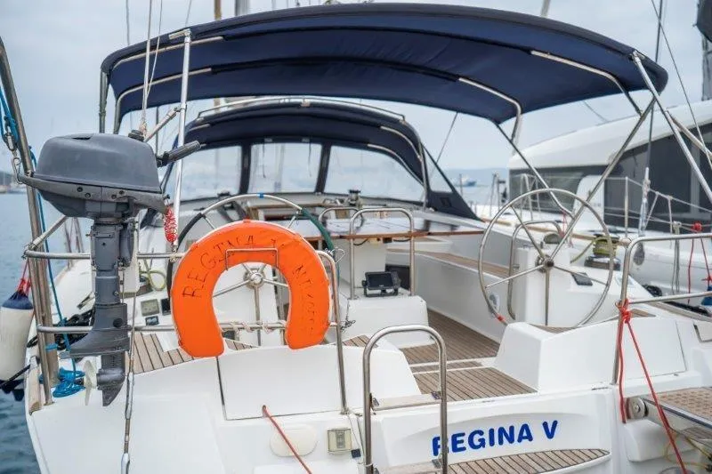  Yacht Photos Pics 2010 Jeanneau 53 sailboat with dual steering wheels and orange life preserver.
