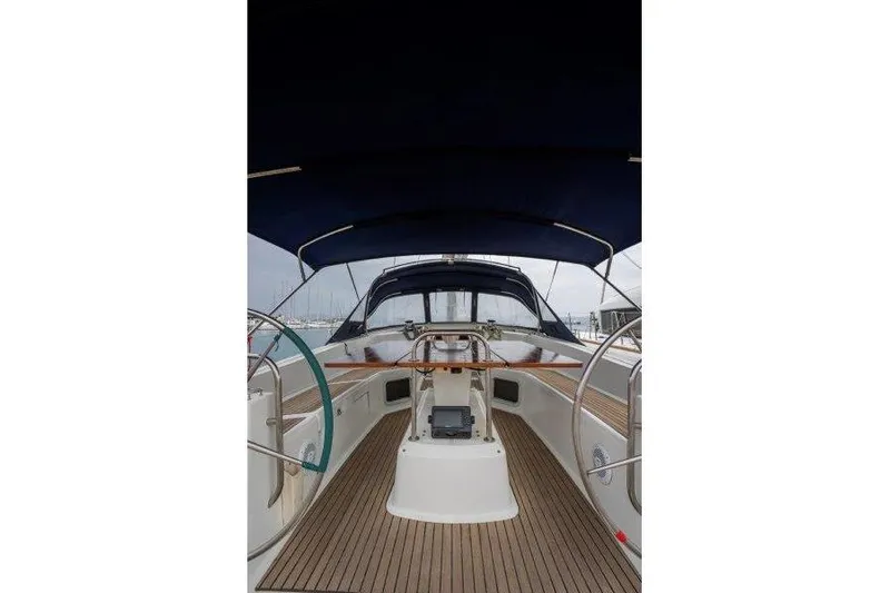  Yacht Photos Pics 2010 Jeanneau 53 yacht cockpit with wooden deck and dual steering wheels.