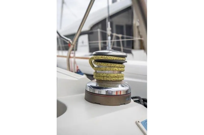  Yacht Photos Pics Winch with yellow rope on 2010 Jeanneau 53 sailboat deck.
