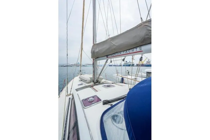  Yacht Photos Pics 2010 Jeanneau 53 sailboat deck view with mast and rigging in harbor.